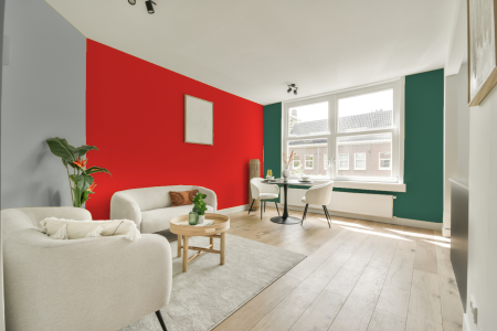 kamer in kleur Ral 3024 met designkleuren op de wanden